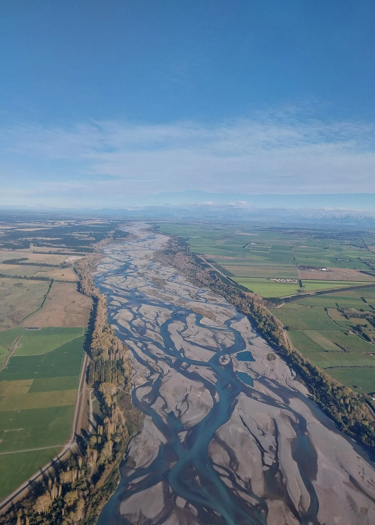 Aerial view of branching river channels and alluvial sediment